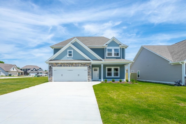 craftsman house with a front yard and a garage