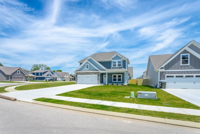 craftsman house with a garage and a front lawn