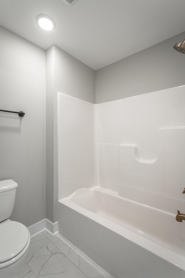 bathroom featuring toilet and  shower combination