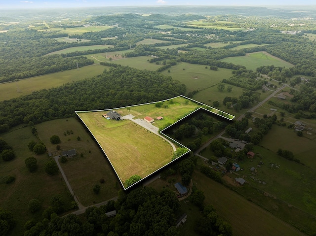 birds eye view of property with a rural view