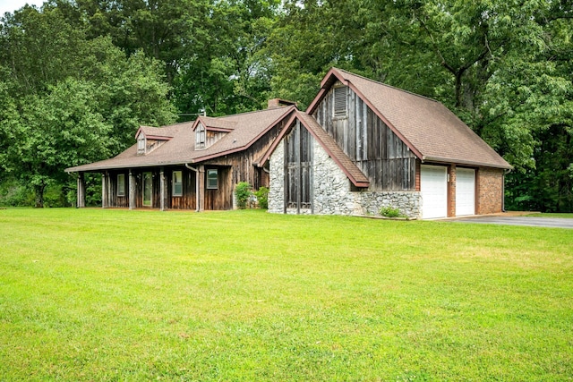 view of front of property with a garage and a front yard