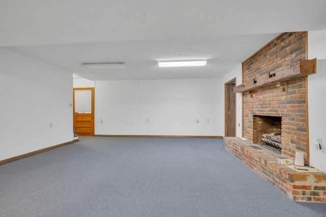 unfurnished living room featuring carpet flooring and a fireplace