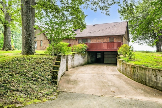 view of front of property with a garage and a deck