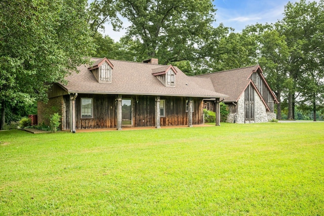 cape cod home with a front lawn