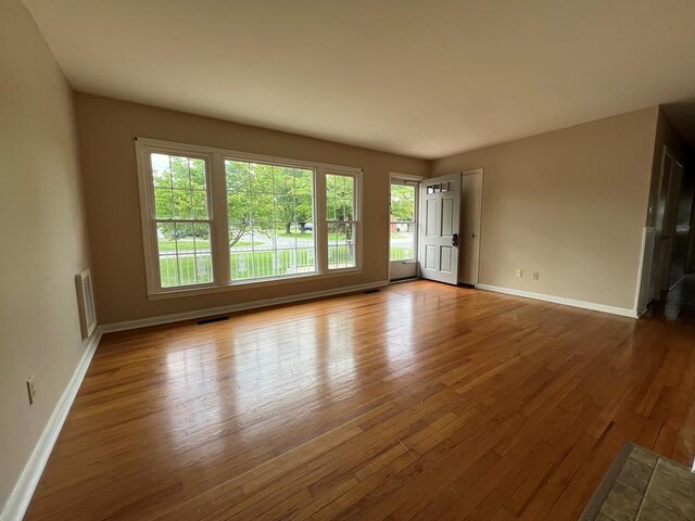 spare room with light hardwood / wood-style floors