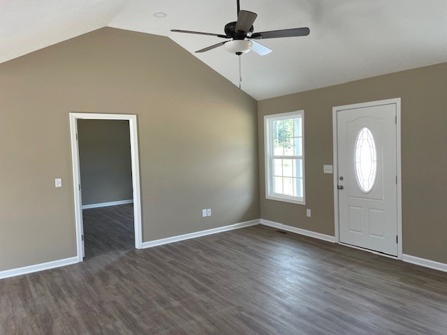 entryway with dark wood-type flooring, ceiling fan, and vaulted ceiling