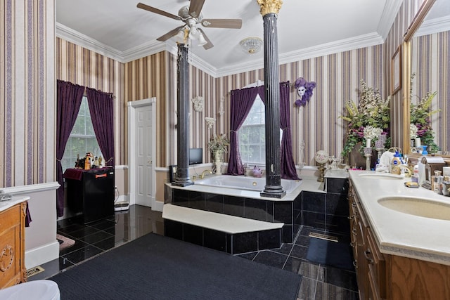 bathroom featuring a relaxing tiled tub, ornamental molding, vanity, and ceiling fan