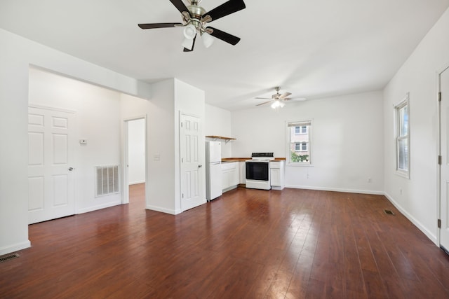 unfurnished living room with dark hardwood / wood-style floors and ceiling fan