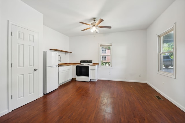 kitchen with ceiling fan, white appliances, butcher block countertops, dark hardwood / wood-style flooring, and white cabinets