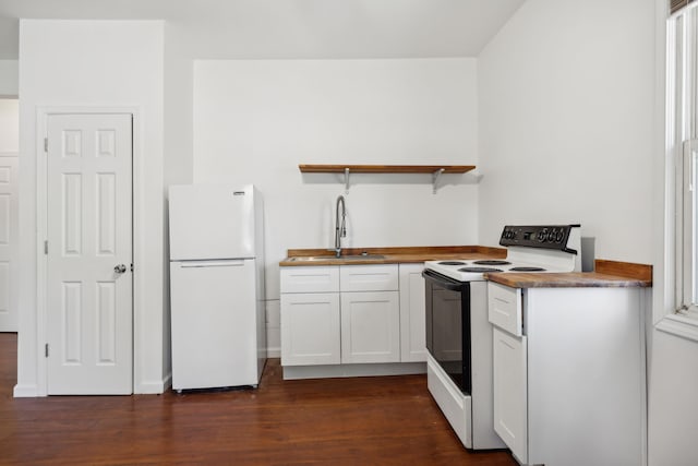 kitchen featuring white cabinets, white appliances, sink, and dark hardwood / wood-style floors