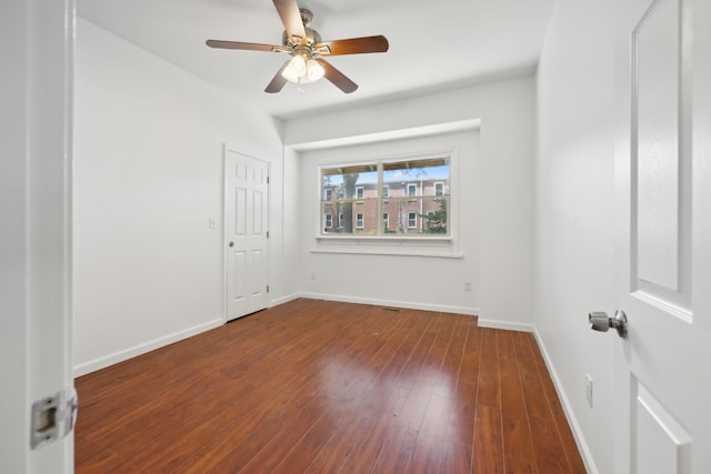 spare room featuring wood-type flooring and ceiling fan