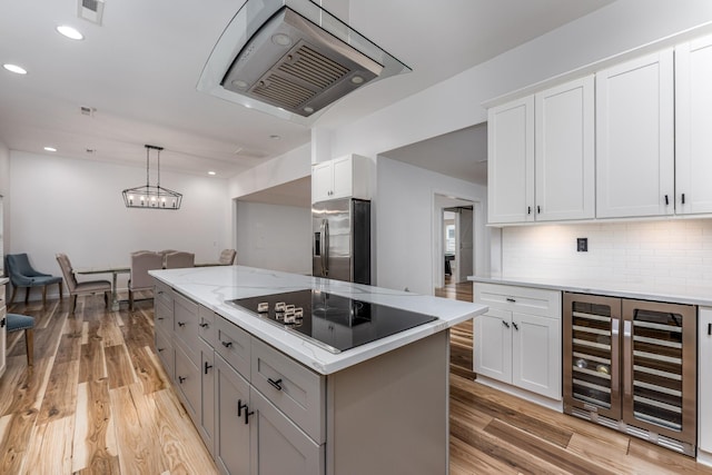 kitchen with decorative backsplash, stainless steel refrigerator with ice dispenser, black electric cooktop, white cabinetry, and wine cooler