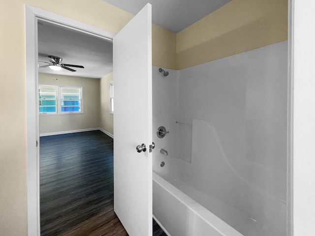 bathroom featuring ceiling fan, shower / bathing tub combination, and hardwood / wood-style flooring