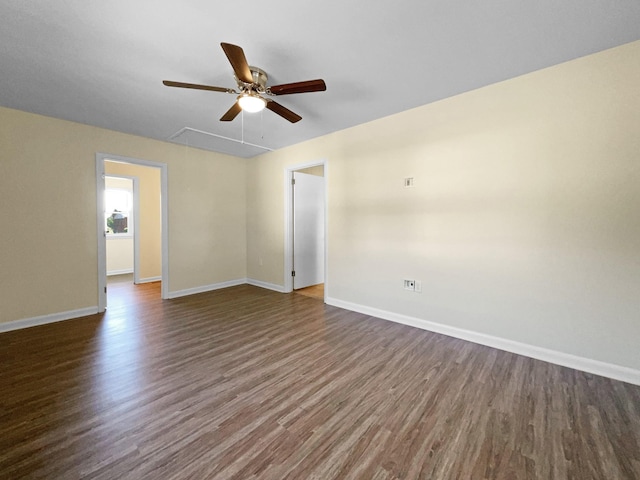 spare room featuring dark wood-type flooring