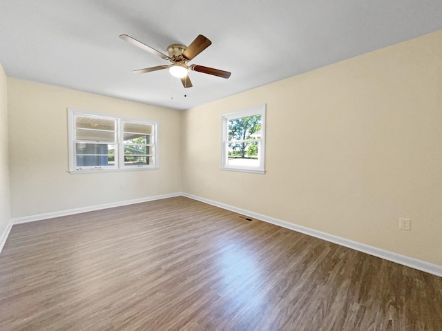 spare room featuring hardwood / wood-style flooring and ceiling fan