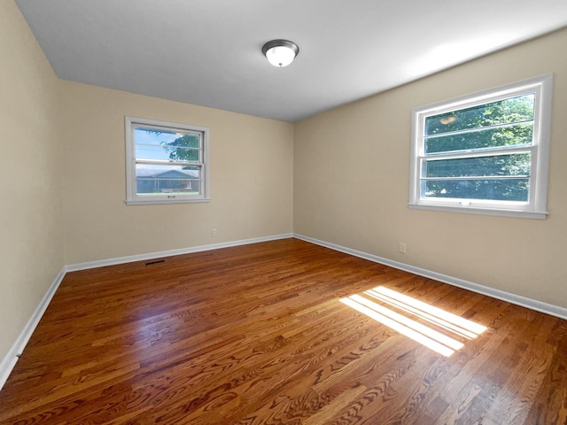 spare room featuring hardwood / wood-style flooring