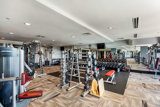 workout area featuring light colored carpet