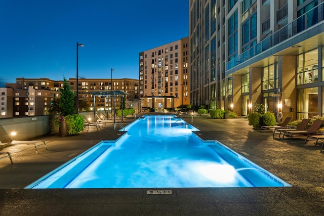 view of swimming pool featuring a patio area