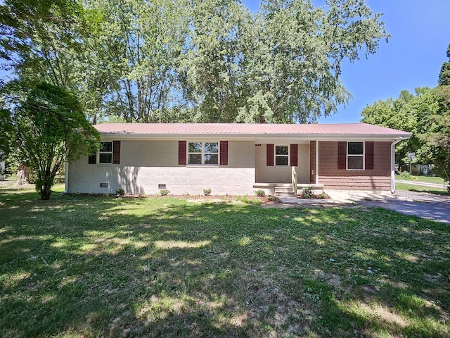 ranch-style home with a front yard