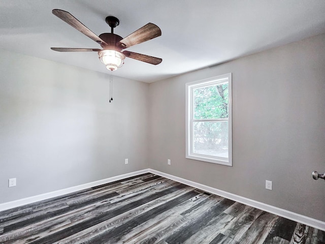 unfurnished room with dark wood-type flooring