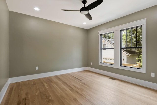 unfurnished room featuring ceiling fan and light hardwood / wood-style flooring