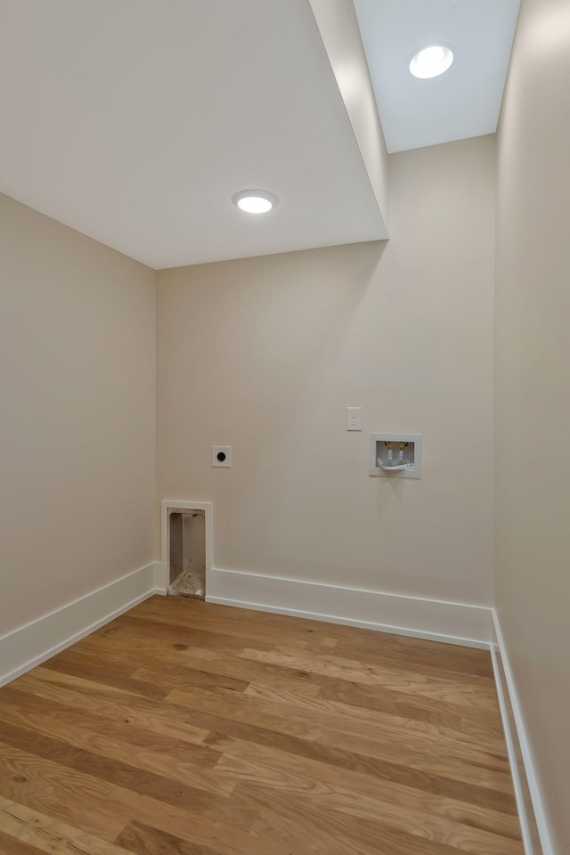 laundry room featuring hookup for an electric dryer, washer hookup, and wood-type flooring