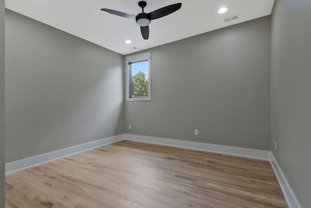 spare room featuring ceiling fan and light wood-type flooring