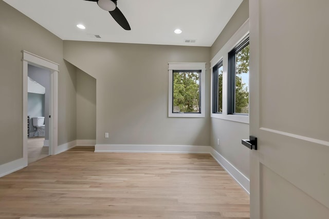 unfurnished room featuring ceiling fan and light hardwood / wood-style floors