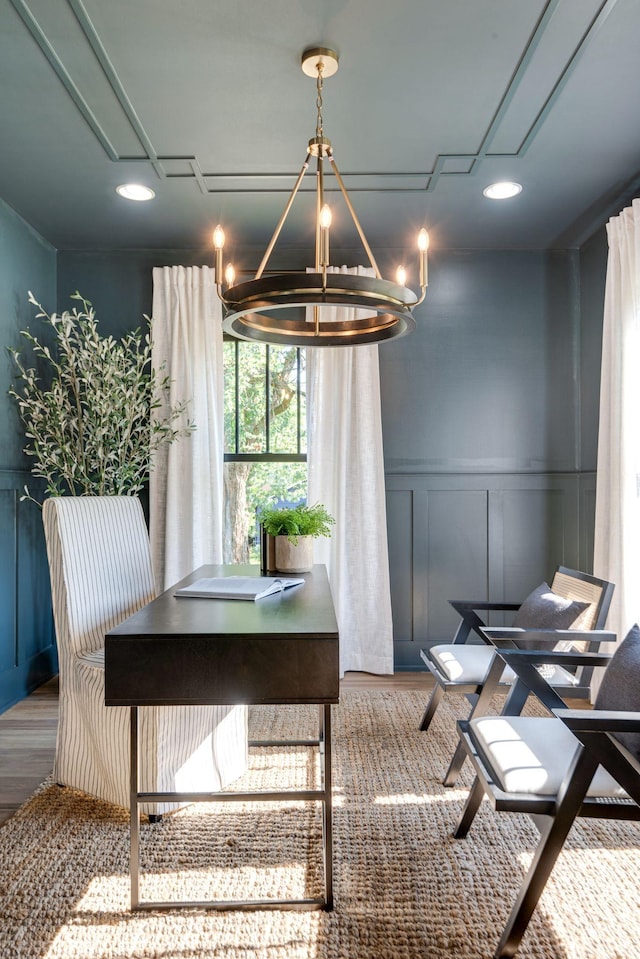 dining room featuring hardwood / wood-style floors and a chandelier