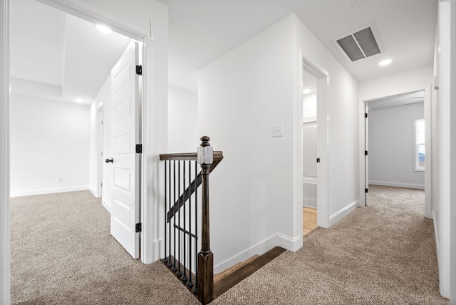 hallway with carpet flooring