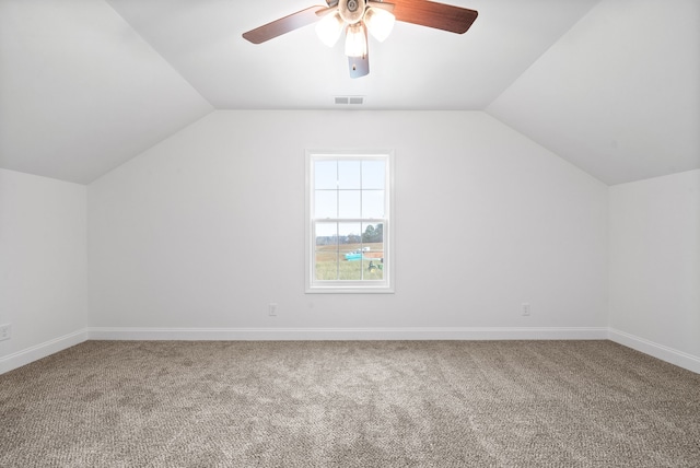 additional living space featuring ceiling fan, lofted ceiling, and carpet floors