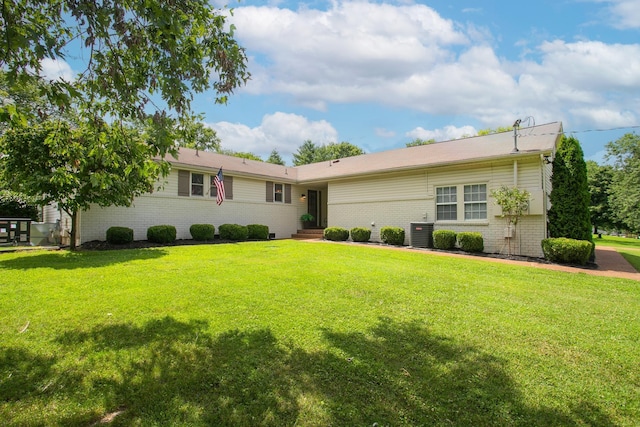 single story home featuring a front lawn and cooling unit