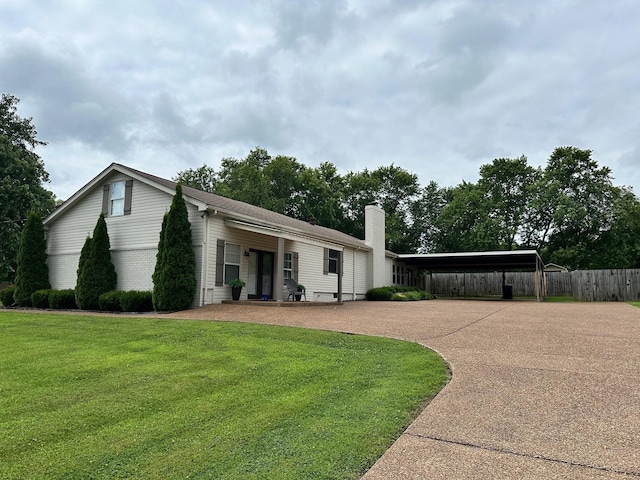 view of front of house featuring a front yard and a carport