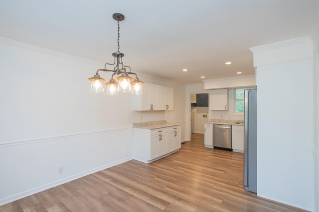 kitchen featuring pendant lighting, white cabinets, appliances with stainless steel finishes, light hardwood / wood-style flooring, and crown molding