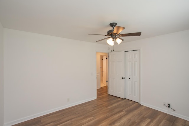 unfurnished room with hardwood / wood-style flooring and ceiling fan