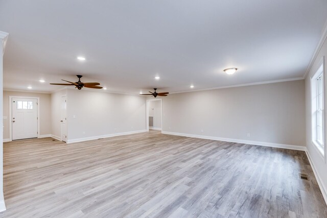 124 Lookout Ln, Pulaski, TN 38478 - unfurnished living room with light wood-type flooring, visible vents, crown molding, and baseboards