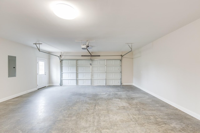 124 Lookout Ln, Pulaski, TN 38478 - garage featuring baseboards, electric panel, and a garage door opener