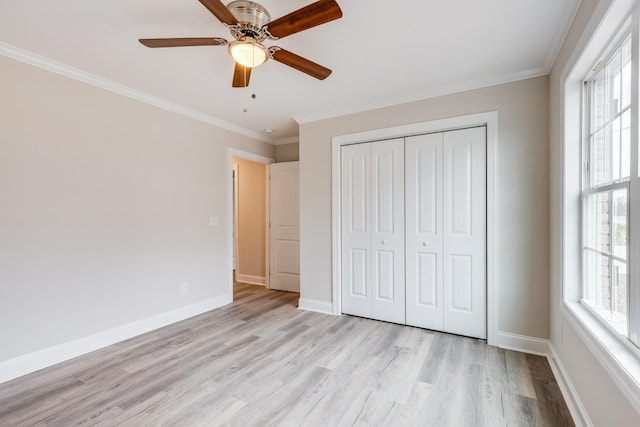124 Lookout Ln, Pulaski, TN 38478 - unfurnished bedroom with ornamental molding, multiple windows, light wood-type flooring, and baseboards