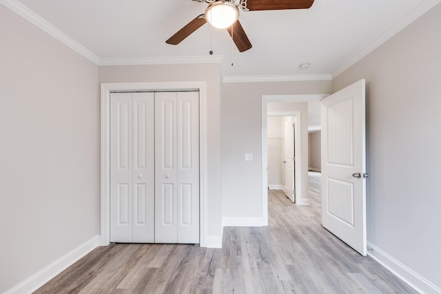 124 Lookout Ln, Pulaski, TN 38478 - unfurnished bedroom featuring light wood-style floors, a closet, baseboards, and crown molding