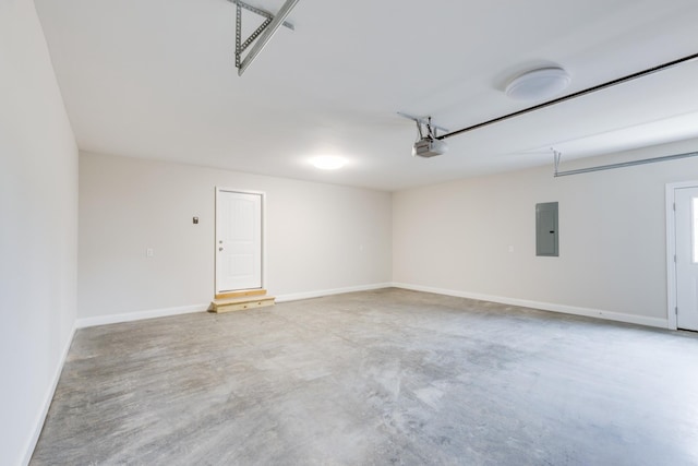 124 Lookout Ln, Pulaski, TN 38478 - garage featuring a garage door opener, electric panel, and baseboards
