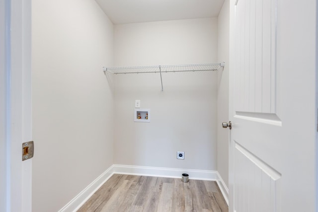 124 Lookout Ln, Pulaski, TN 38478 - clothes washing area featuring hookup for a washing machine, electric dryer hookup, light wood-type flooring, laundry area, and baseboards