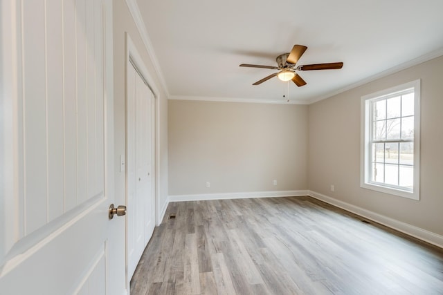 124 Lookout Ln, Pulaski, TN 38478 - unfurnished room with baseboards, visible vents, a ceiling fan, ornamental molding, and light wood-style floors