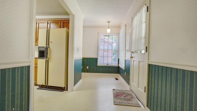 interior space with crown molding