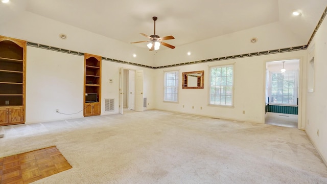 carpeted spare room with ceiling fan