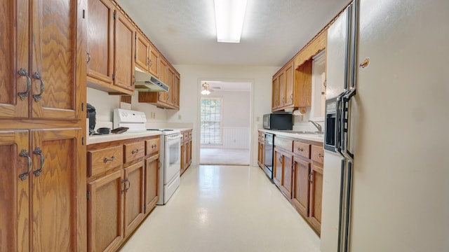 kitchen with fridge with ice dispenser, electric range, sink, ceiling fan, and black dishwasher