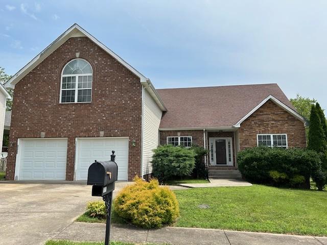 view of front of home featuring a garage and a front lawn