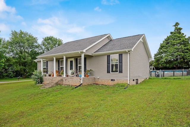 view of front facade featuring covered porch and a front yard