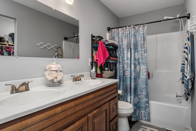 full bathroom with vanity, toilet, and shower / tub combo