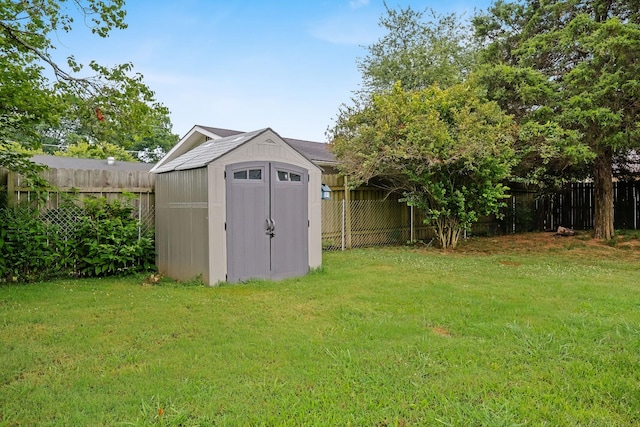 view of outbuilding with a lawn