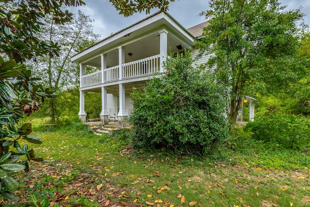 back of property with a balcony